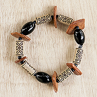 Eco-friendly beaded stretch bracelet, 'Coconut Charm' - Artisan Crafted Beaded Bracelet from Ghana