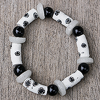 Glass beaded stretch bracelet, 'Black and White Grace' - Handmade Recycled Glass Beaded Bracelet in Black and White
