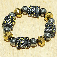 Recycled glass beaded stretch bracelet, 'Leebi Beauty' - Handcrafted Golden and Black Recycled Glass Beaded Bracelet