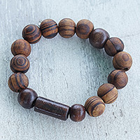 Wood beaded stretch bracelet, 'My Forest Friend' - Handcrafted Sese Wood Beaded Stretch Bracelet from Ghana