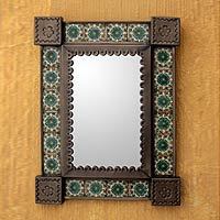 Tin and ceramic wall mirror,