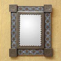 Tin and ceramic wall mirror,