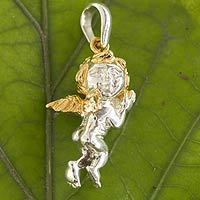 Gold accent sterling silver pendant,