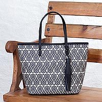 Leather accented coated canvas tote bag,