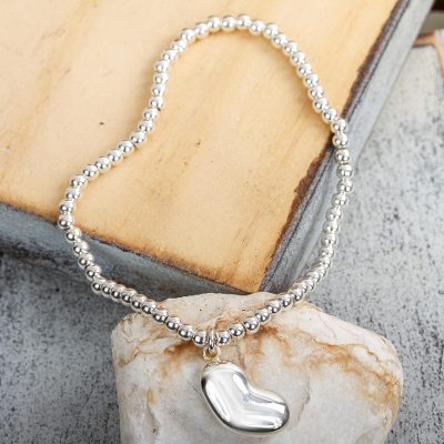 Sterling silver charm bracelet, 'Love from the Heart' - Handcrafted Taxco Sterling Silver Stretch Charm Bracelet