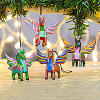 Wood alebrije ornaments, 'Colorful Pegasus' (set of 4) - Four Hand-Painted Pegasus Alebrije Ornaments from Mexico