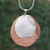 Sterling silver and copper pendant necklace, 'Rippling Eclipse' - Sterling Silver and Copper Pendant Necklace from Mexico thumbail