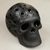 Ceramic figurine, 'Macrocosm Skull' - Circle Motif Barro Negro Ceramic Skull Figurine from Mexico thumbail