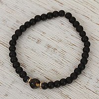 Gold accented amber and onyx beaded stretch bracelet,
