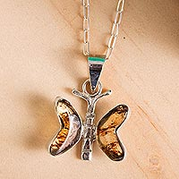 Amber pendant necklace, 'Ancient Butterfly' - Natural Amber Butterfly Pendant Necklace from Mexico
