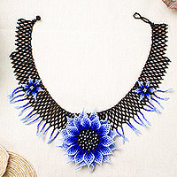 Glass beaded statement necklace, 'Sapphire Spring' - Handcrafted Floral Beaded Statement Necklace in Sapphire