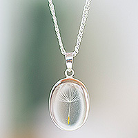 Natural flower pendant necklace, 'Daylight Rebirth' - Oval Clear Natural Dandelion Resin Pendant Necklace