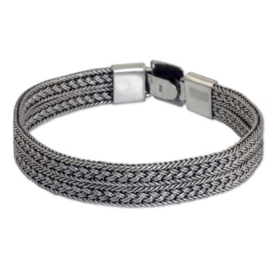 Men's sterling silver bracelet, 'Distinction' - Men's Wide Sterling Silver Braided Bracelet Thailand