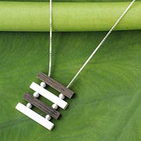 Sterling silver and wood pendant necklace, 'Nature's Balance' - Artisan Crafted Necklace Sterling Silver and Wood