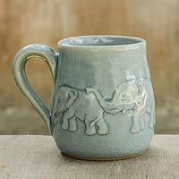 Celadon ceramic mug, 'Light Blue Elephant Parade' - Handcrafted Glazed Celadon Ceramic Mug (9 oz)