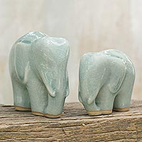 Celadon ceramic figurines, 'Elephant Bond in Light Blue' (pair) - Light Blue Celadon Ceramic Figurines of Elephants (Pair)