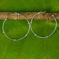 Sterling silver half-hoop earrings,