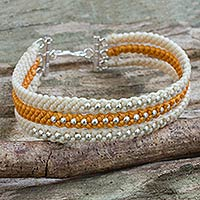 Silver beaded wristband bracelet, 'Orange and Cream' - Ivory and Orange Macrame Bracelet with Hill Tribe Silver