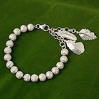 Sterling silver beaded charm bracelet,