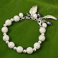 Silver and cultured pearl beaded charm bracelet,