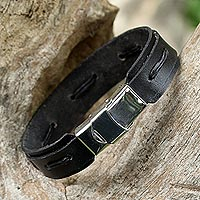 Leather wristband bracelet, 'Roadside Stroll in Black' - Hand Crafted Black Leather Wristband Bracelet from Thailand