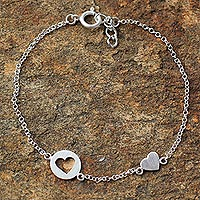 Sterling silver station bracelet, 'Puzzling Hearts' - Sterling Silver Heart Shaped Station Bracelet from Thailand