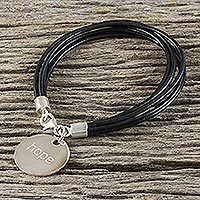 Silver and leather charm bracelet,