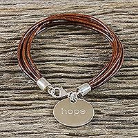 Silver and leather charm bracelet,