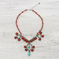 Carnelian pendant necklace, 'Symmetrical Bubbles' - Carnelian and Calcite Beaded Pendant Necklace from Thailand