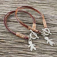 Leather and silver charm bracelets,
