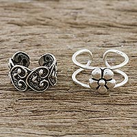 Sterling silver ear cuffs, 'Flower Love' - Floral and Heart Motif Sterling Silver Ear Cuffs