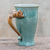 Celadon ceramic mug, 'Elephant Handle in Green' - Elephant-Themed Celadon Ceramic Mug from Thailand