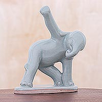 Celadon ceramic figurine, 'Elephant Triangle Pose' - Hand Crafted Ceramic Elephant Yoga Figurine from Thailand