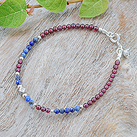 Lapis lazuli and garnet charm bracelet, 'Bright Mind in Red' - Lapis Lazuli and Garnet Beaded Charm Bracelet