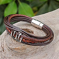 Leather pendant bracelet, 'Fanged in Brown' - Handmade Braided Leather Pendant Bracelet