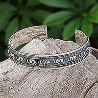Sterling silver cuff bracelet, 'On Parade in Small' - Sterling Silver Elephant-Themed Cuff Bracelet