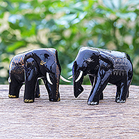 Gold-accented wood statuettes, 'Rogue Elephants' (pair) - Black Raintree Wood Elephant Statuettes (Pair)