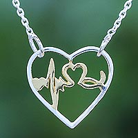 Gold-accented sterling silver pendant necklace, 'Be Still My Heart' - Artisan Crafted Gold Accent Necklace