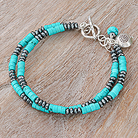 Hematite beaded charm bracelet, 'Spaced Energies' - Hematite and Recon Turquoise Beaded Bracelet with Charms
