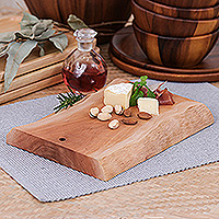 Wood cutting board, 'Strong Flavors' - Hand-Carved Sturdy Longan Wood Cutting Board from Thailand