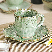 Celadon ceramic cup and saucer, 'Lotus Table' - Lotus-Inspired Speckled Green Celadon Ceramic Cup and Saucer