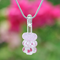 Glass beaded pendant necklace, 'Pretty Amulets' - Floral Pink Glass Beaded Pendant Necklace from Thailand