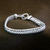 Sterling silver braided bracelet, 'Links of Power' - Sterling Silver Chain Bracelet thumbail