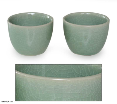 Stoneware tea cups, 'Green Legends' (pair) - Green Stoneware Ceramic Tea Cups (Pair)