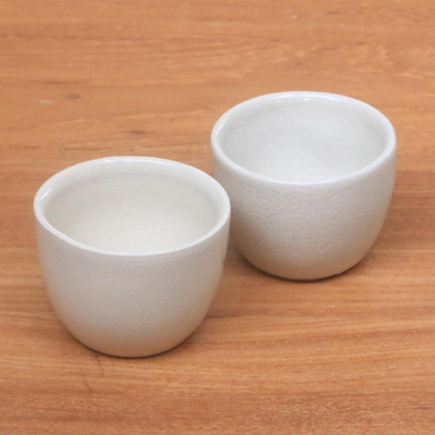 Stoneware tea cups, 'Legends' (pair) - Stoneware tea cups (Pair)