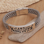 Sterling silver bangle bracelet, 'Crown of Petals' - Floral Sterling Silver Wristband Bracelet