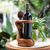 Wood wine bottle holder, 'The Offering' - Hand Carved Suar Wood Wine Bottle Holder