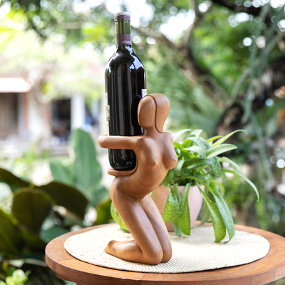 Wood wine bottle holder, 'The Surprise' - Carved Wood Wine Bottle Holder