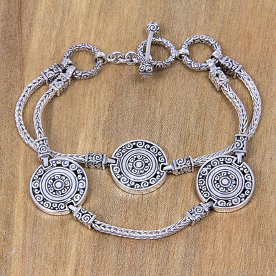 Sterling silver charm bracelet, 'Coins of the Kingdom' - Indonesian Good Fortune Sterling Silver Bracelet