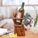 Wood wine bottle holder, 'Embrace' - Hand Carved Nude Figure Wine Bottle Holder